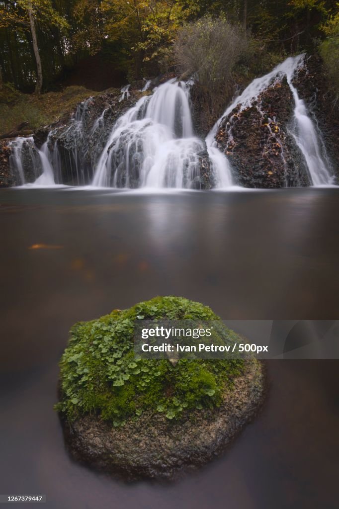 Small Waterfall And Mini Island In River
