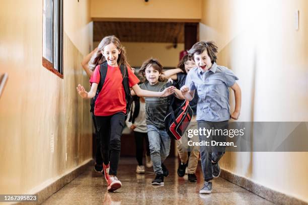 Kid Rushing To Classa Kids Running Out Of Classroom Photos and Premium High Res Pictures ...