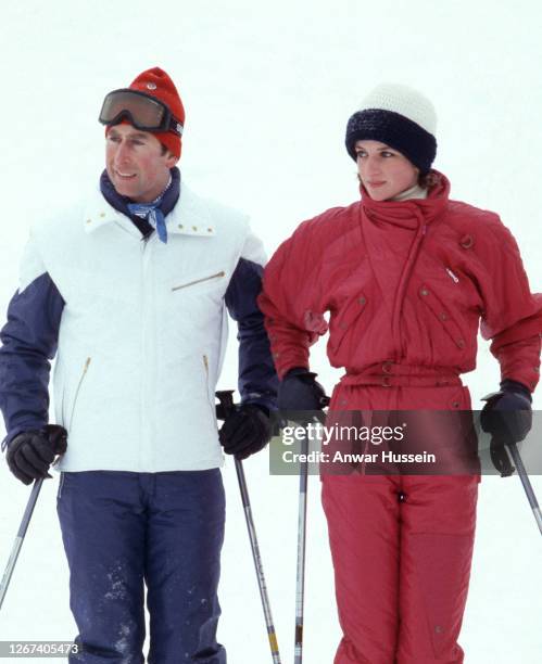 Prince Charles, Prince of Wales and Diana, Princess of Wales, wearing a red ski suit by Head, pose during a skiing holiday on January 24, 1985 in...