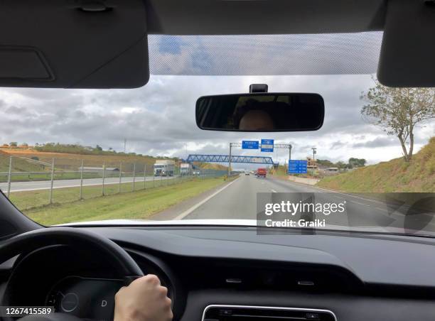 point of view of a woman driver at the highway - truck front view stock pictures, royalty-free photos & images