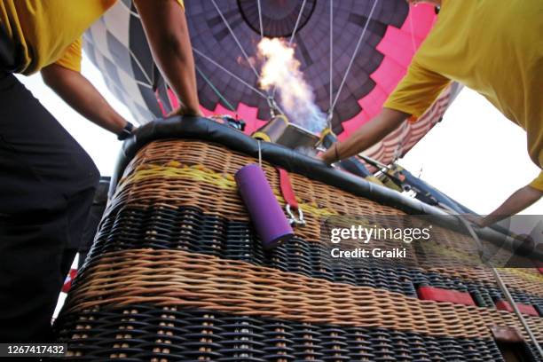 hot air ballon taking off - hot air balloon people stock pictures, royalty-free photos & images