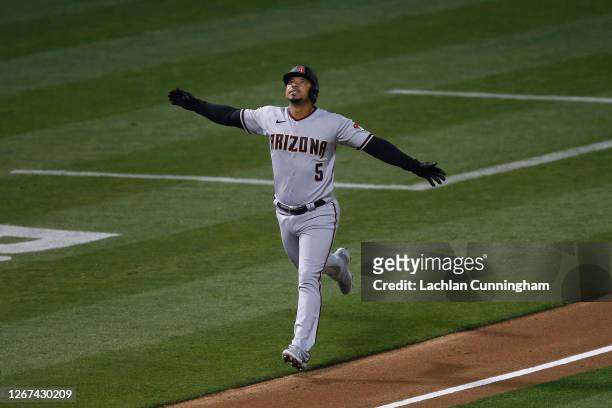 Eduardo Escobar of the Arizona Diamondbacks celebrates after hitting a solo home-run in the top of the fifth inning against the Oakland Athletics at...