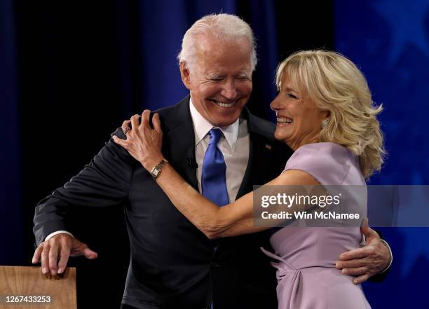 Democratic presidential nominee Joe Biden greets his wife Dr. Jill Biden on the fourth night of the Democratic National Convention from the Chase...