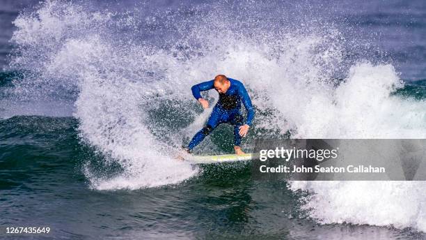 tunisia, surfing in the mediterranean sea - tunisia surfing one person stock pictures, royalty-free photos & images