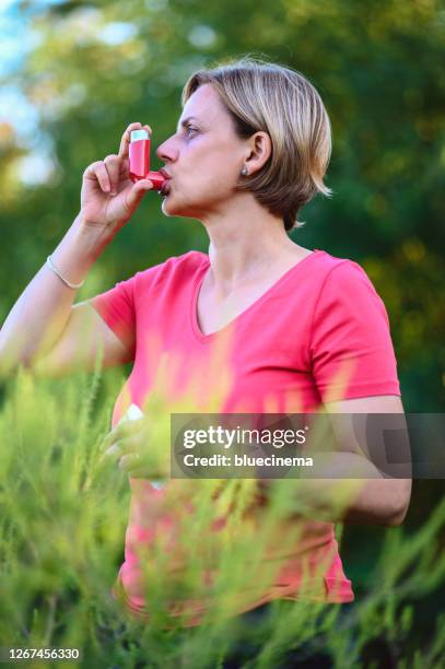 asthmatic inhaler - asthmatic stock pictures, royalty-free photos & images