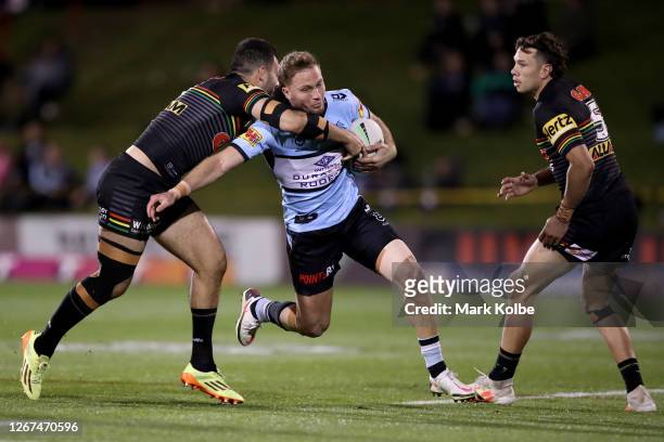 Matt Moylan of the Sharks charges forward during the round 15 NRL match between the Penrith Panthers and the Cronulla Sharks at Panthers Stadium on...
