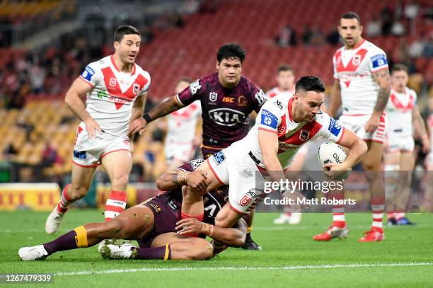 Corey Norman of the Dragons scores a try during the round 15 NRL match between the Brisbane Broncos and the St George Illawarra Dragons at Suncorp...