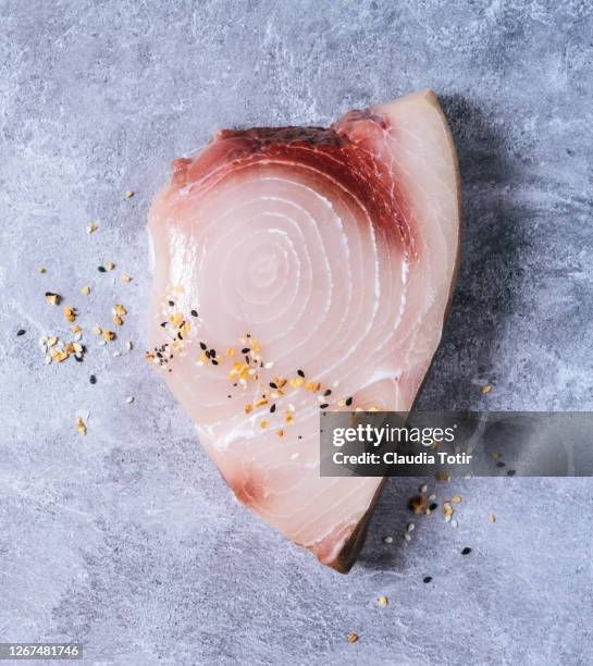 swordfish steak on gray background - raw fish stockfoto's en -beelden