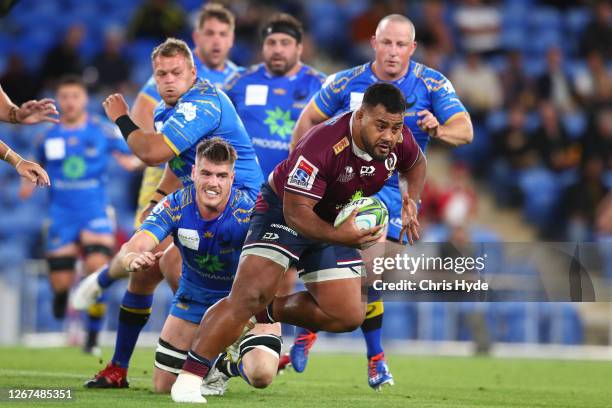 Taniela Tupou of the Reds is tackled during the round eight Super Rugby AU match between the Western Force and the Queensland Reds at Cbus Super...