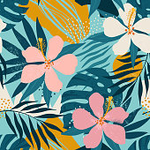 Tropical flowers and artistic palm leaves on background. Seamless. Vector pattern.