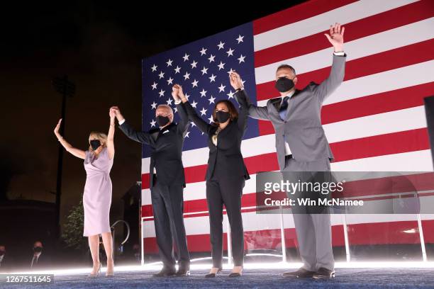Democratic presidential nominee Joe Biden, his wife Dr. Jill Biden, Democratic Vice Presidential nominee Kamala Harris and her husband Douglas Emhoff...