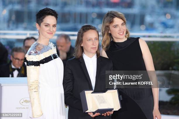 Celine Sciamma , winner of the Best Screenplay award for her film "Portrait de la Jeune Fille en Feu", poses with Noemie Merlant and Adele Haenel at...