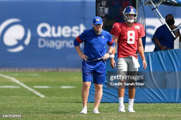 Offensive coordinator Jason Garrett looks on with Daniel Jones of the New York Giants during training camp at NY Giants Quest Diagnostics Training...