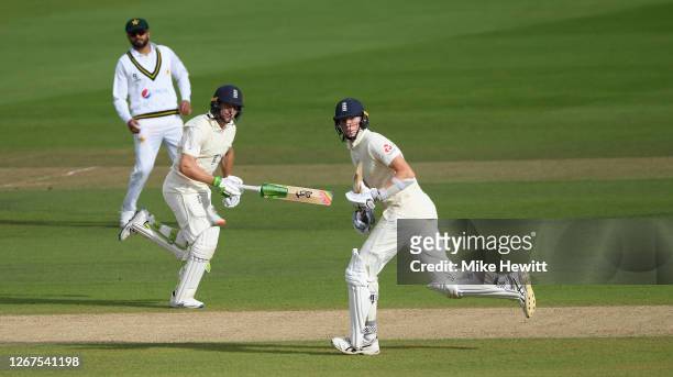 Zak Crawley and Jos Buttler of England take a run during Day One of the 3rd #RaiseTheBat Test Match between England and Pakistan at the Ageas Bowl on...
