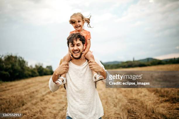 happy with my dad - carrying on shoulders stock pictures, royalty-free photos & images