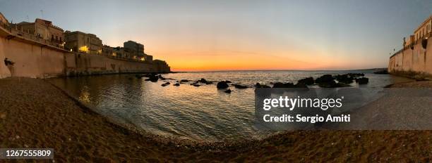 sunrise on the beach in ortigia, siracusa - siracusa stock pictures, royalty-free photos & images