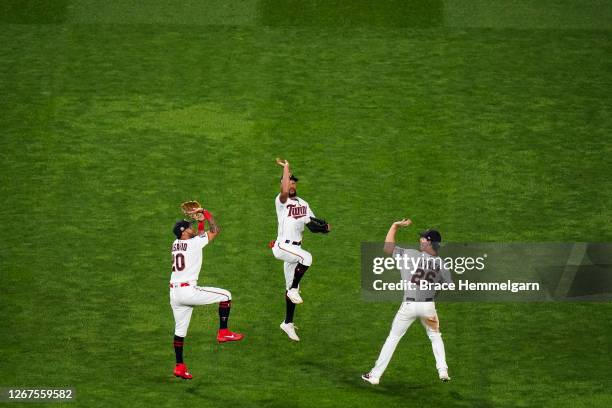 Eddie Rosario, Byron Buxton and Max Kepler of the Minnesota Twins celebrate against the Kansas City Royals on August 17, 2020 at Target Field in...