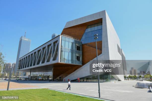 Workers at the construction site of the Tianjin Juilliard School, the first overseas campus of New York's renowned Juilliard School, on August 21,...