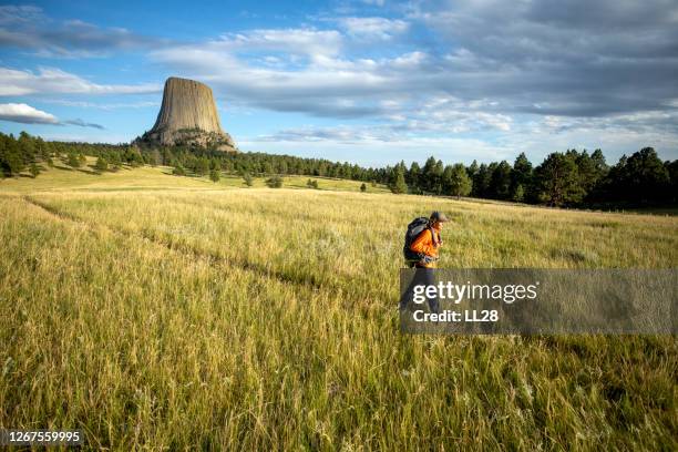 backpacker hiking - devils tower stock pictures, royalty-free photos & images