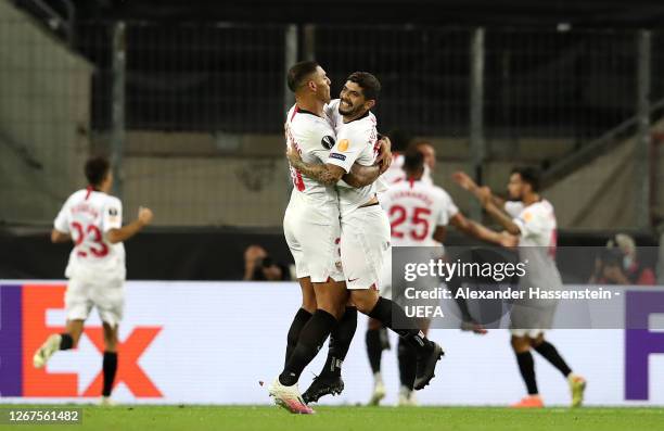 Diego Carlos and Ever Banega of Sevilla celebrate after their team's first goal during the UEFA Europa League Final between Seville and FC...