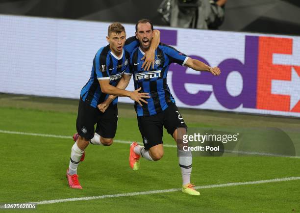 Diego Godin of Inter Milan celebrates with teammate Nicolo Barella after scoring his team's second goal during the UEFA Europa League Final between...