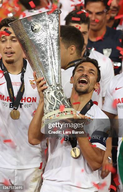 Jesus Navas, Captain of Sevilla lifts the UEFA Europa League trophy following his team's victory in the UEFA Europa League Final between Seville and...