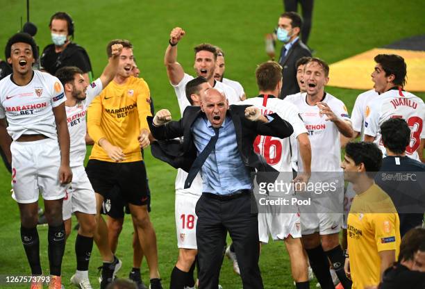 Ramon Rodriguez Verdejo, Director of Football of Seville celebrates with players following the UEFA Europa League Final between Seville and FC...