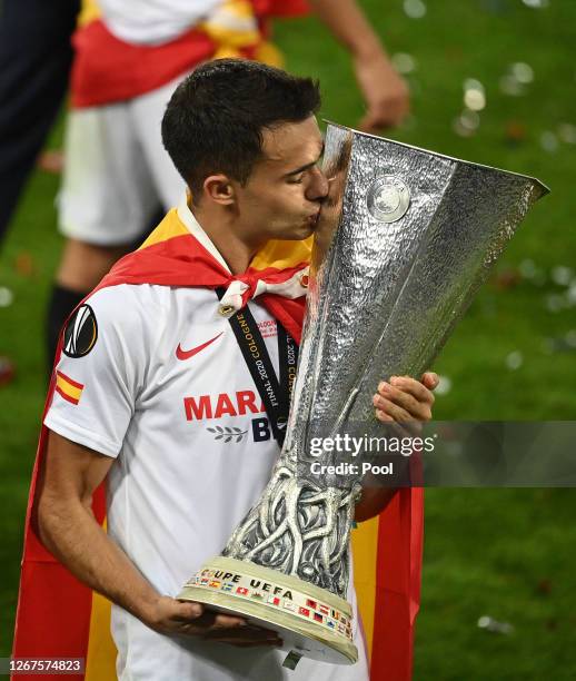 Sergio Reguilon of Sevilla FC kisses the UEFA Europa League Trophy in celebration following his team's victory in the UEFA Europa League Final...