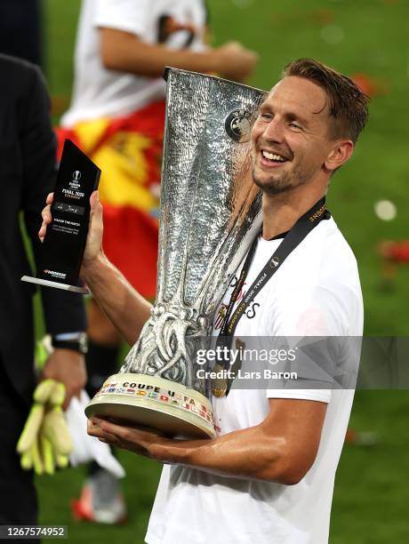 Luuk de Jong of Sevilla celebrates with the UEFA Europa League Trophy and his UEFA Europa League Man of the Match award following his team's victory...