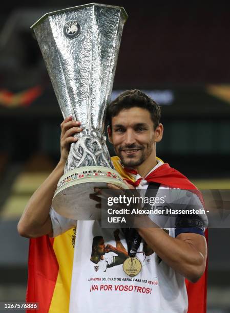 Jesus Navas of Sevilla celebrates with the UEFA Europa League Trophy following his team's victory in the UEFA Europa League Final between Seville and...