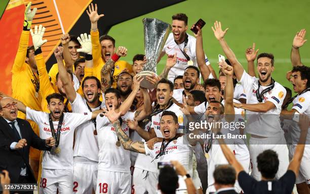 Lucas Ocampos of Sevilla and his teammates lift the UEFA Europa League Trophy following their team's victory in the UEFA Europa League Final between...