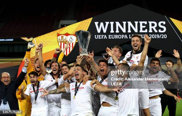 Lucas Ocampos of Sevilla and his teammates lift the UEFA Europa League Trophy following their team's victory in the UEFA Europa League Final between...