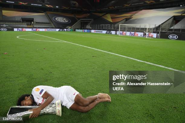 Jules Kounde of Sevilla FC celebrates with the UEFA Europa League Trophy following his team's victory in the UEFA Europa League Final between Seville...