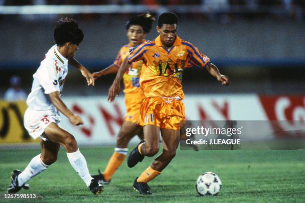 Djalminha of Shimizu S-Pulse and Tetsuo Nakanishi of Nagoya Grampus Eight compete for the ball during the J.League Nicos Series match between Shimizu...
