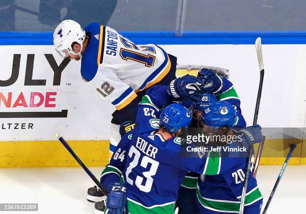 Tyler Motte and the Vancouver Canucks celebrate his goal at 13:19 of the third period against the St. Louis Blues in Game Six of the Western...