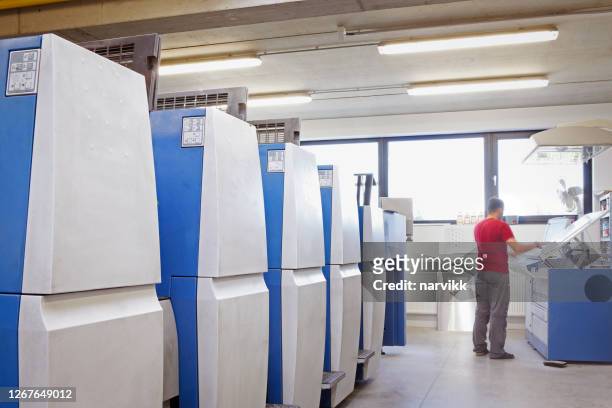 printer at the printing plant - printing plate stock pictures, royalty-free photos & images