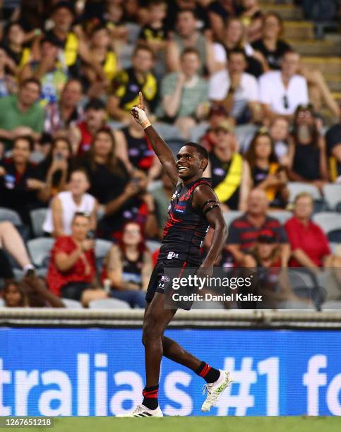 Irving Mosquito of the Bombers celebrates after kicking his first goal on debut during the round 13 AFL match between the Essendon Bombers and the...