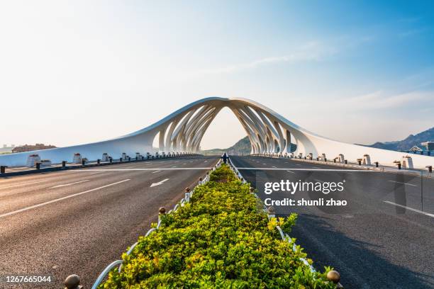 modern bridge structure - qingdao bridge stock pictures, royalty-free photos & images