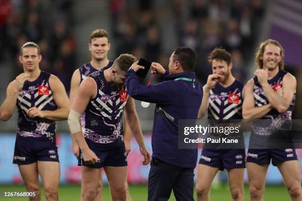 Luke Ryan of the Dockers is presented the Goodes-O'Loughlin Medal by Peter Bell during the round 13 AFL match between the Fremantle Dockers and the...