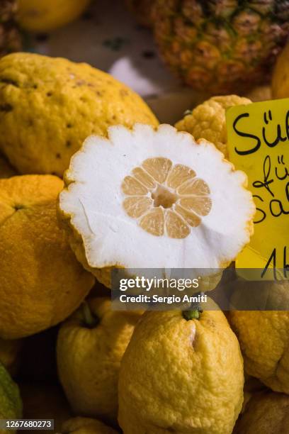 citron lemon on sale at market - citron stock pictures, royalty-free photos & images