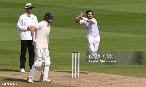 Yasir Shah of Pakistan bowls watched on by Zak Crawley of England during Day Two of the 3rd #RaiseTheBat Test Match between England and Pakistan at...