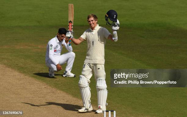 Zac Crawley of England celebrates reaching his double century as Naseem Shah of Pakistan reacts during the second day of the third Test match between...