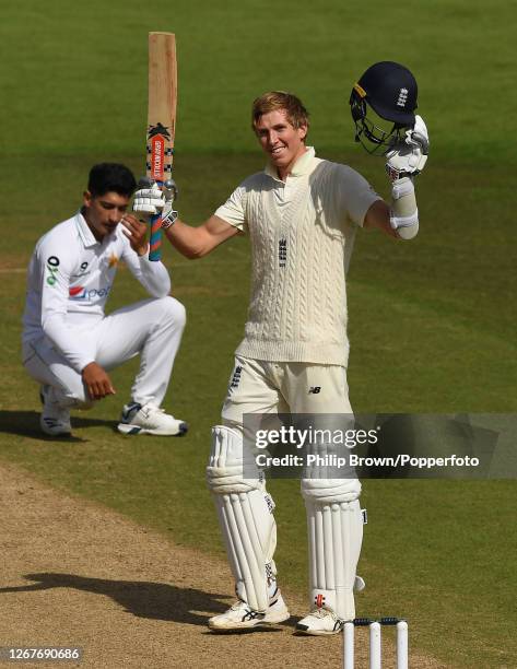 Zac Crawley of England celebrates reaching his double century as Naseem Shah of Pakistan reacts during the second day of the third Test match between...