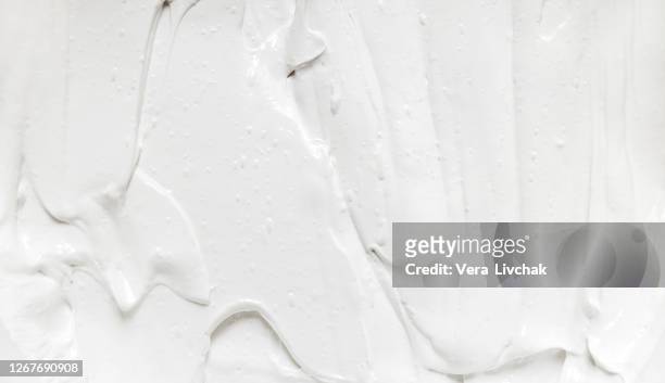 stylish smear of cosmetic texture closeup. flat lay style. white cosmetic texture. beauty cream texture background. skincare cosmetic product strokes - creme stock-fotos und bilder