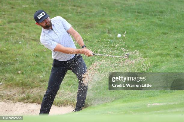 Liam Johnston of Scotland plays out of a bunker on the 18th green during Day 3 of the Wales Open at the Celtic Manor Resort on August 22, 2020 in...