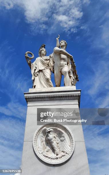 "athena leads the young warrior into the fight" sculptural group on pedestal of the schlossbrücke bridge in the central mitte district of berlin, germany - athena greek goddess stock pictures, royalty-free photos & images