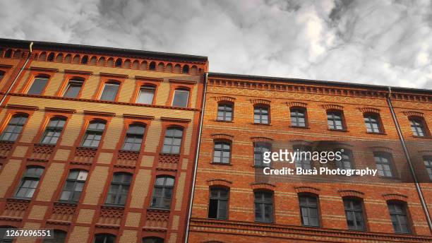 view from below of pre-war residential buildings in the district of prenzaluer berg, berlin, germany - prenzlauer berg stock pictures, royalty-free photos & images