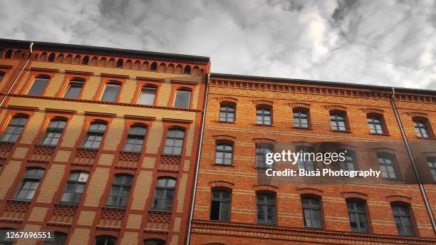 view from below of pre-war residential buildings in the district of prenzaluer berg, berlin, germany - prenzlauer berg imagens e fotografias de stock