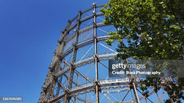 large gasometer in berlin, district of schoeneberg (schöneberg gasometer). berlin, germany - gas container stock pictures, royalty-free photos & images