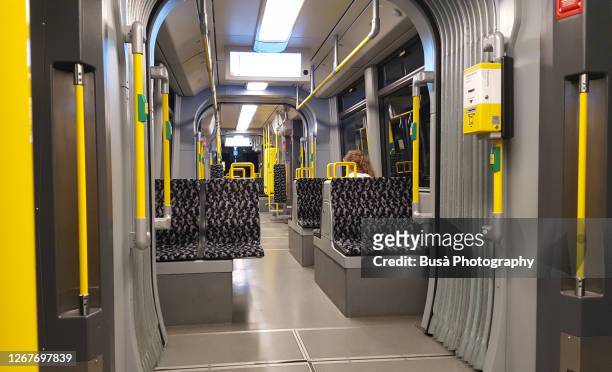 interior of a subway (u-bahn) car in berlin, germany - berlin stock-fotos und bilder